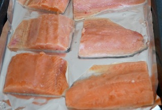 salmon fillets on baking pan