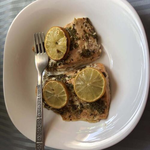 baked salmon in a bowl with fork