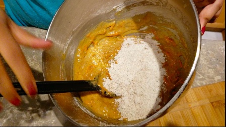 adding flour to cake mix