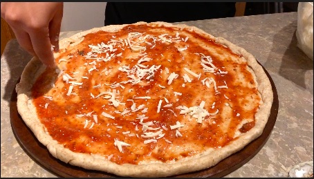 cheese and pizza sauce on crust