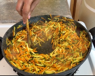 sauteed carrot and zucchini in pan